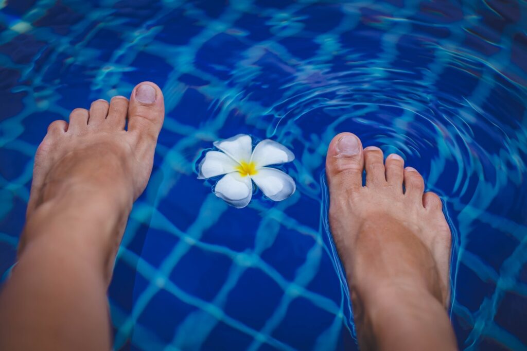 dipping your foot in the pool to relax
