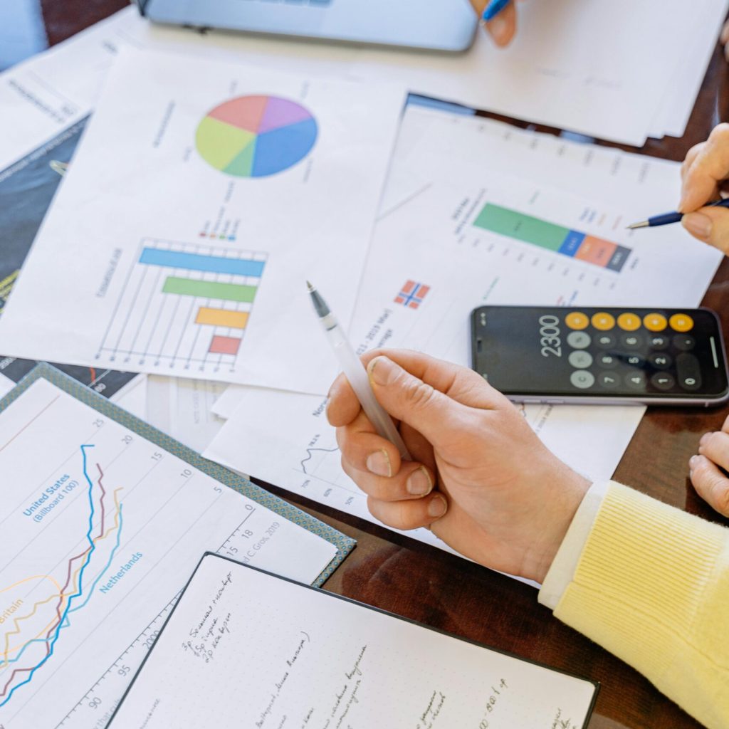 pexels-photo-5816298-5816298 A close-up of businesspeople analyzing financial data and charts during a meeting.